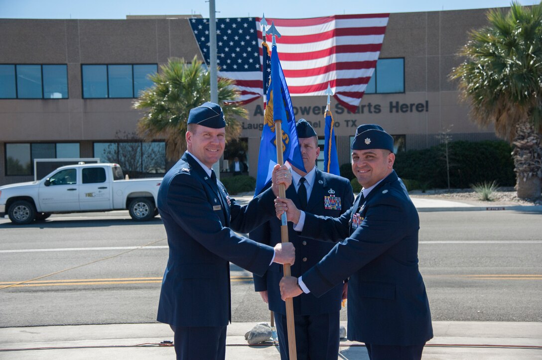 Lieutenant Colonel Andrew Katz formally assumed command of the 47th Operations Support Squadron during a transfer of responsibility, March 2, 2018, here. This type of formal military event, dated back to Frederick the Great of Prussia, includes the passing of a flag to the new commander to signify a public assumption of command. (U.S. Air Force photo/Airman 1st Class Daniel Hambor)