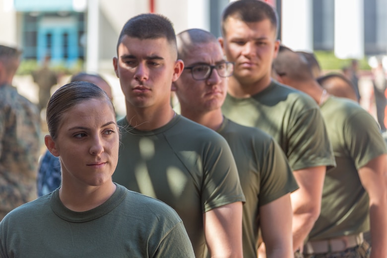 U.S. Marine Pfc. Kira Kozik, the first female Marine student to check in to School of Infantry – West, stands in line to turn in her medical records on Camp Pendleton, March 6, 2018. This marks the first male-female integrated Marine Combat Training company on the West Coast.
