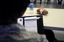 U.S. Air Force Airman 1st Class Ja’daiza Johnson, 20th Equipment Maintenance Squadron ammunitions flight precision guided munitions crew member, takes notes during a “Let’s Connect Shaw” Women’s Mentorship Forum at Shaw Air Force Base, S.C., Feb. 22, 2018. The lunch and learn, while focused towards the women of Team Shaw, was open to all members to participate in discussions around the mental domain of Comprehensive Airman Fitness. (U.S. Air Force photo by Senior Airman Kelsey Tucker)