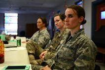 U.S. Air Force Maj. Amanda Pelkowski, 20th Force Support Squadron operations officer, listens to a speaker during a “Let’s Connect Shaw” Women’s Mentorship Forum at Shaw Air Force Base, S.C., Feb. 22, 2018. Pelkowski was one of many women from across Team Shaw that attended the lunch and learn in order to participate in discussions about mental health, deployment and spouse programs at Shaw. (U.S. Air Force photo by Senior Airman Kelsey Tucker)