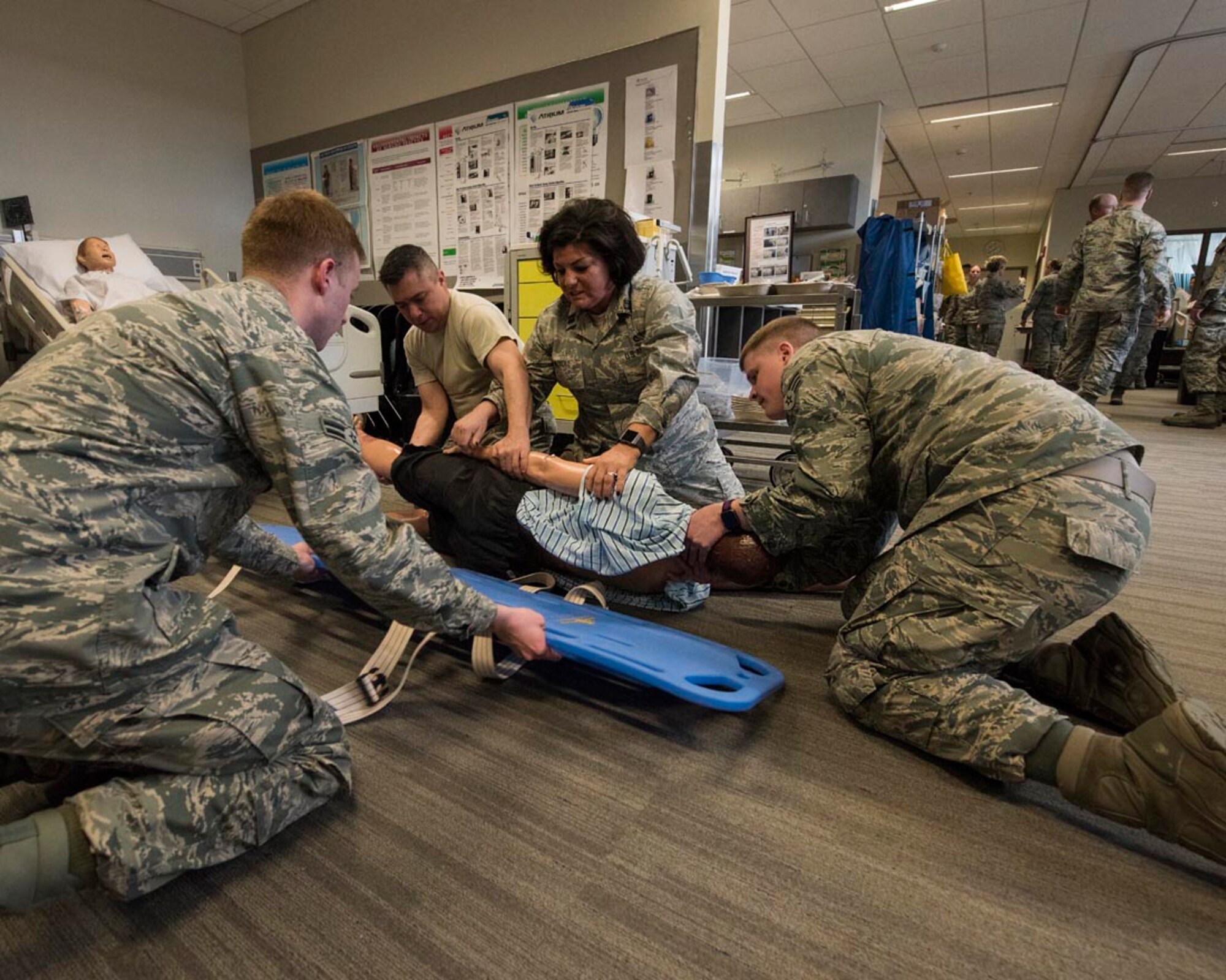 Guardsmen from the 141st Medical Group practice patient transport March 4, 2018 at the Washington State University College of Nursing Riverpoint Campus in Spokane, Wash. More than 45 nurses, medics and medical providers from the 141st MDG as well as seven medical personnel assigned to the 92nd MDG teamed up for the combined training during March’s unit training assembly. (U.S. Air National Guard photo by Staff Sgt. Rose M. Lust)