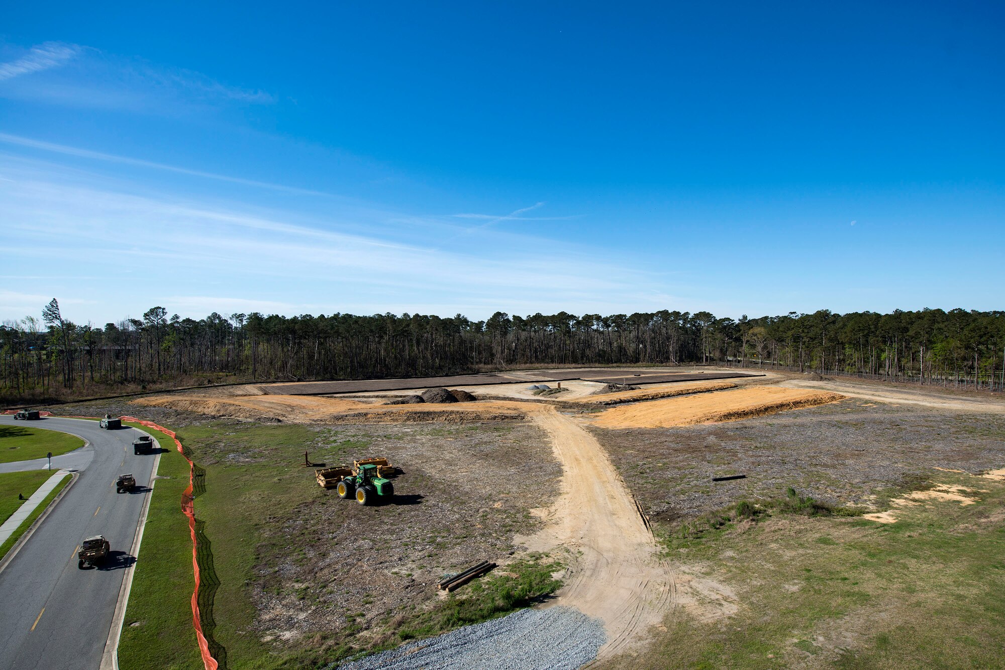 Vehicles drive past the construction site for the new rescue complex, March 7, 2018, at Moody Air Force Base, Ga. The base is improving the Guardian Angel’s capabilities by building them new facilities to group the rescue assets closer together, so as to help better prepare for the future of their mission of saving lives. (U.S. Air Force photo by Airman 1st Class Erick Requadt)