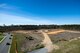 Vehicles drive past the construction site for the new rescue complex, March 7, 2018, at Moody Air Force Base, Ga. The base is improving the Guardian Angel’s capabilities by building them new facilities to group the rescue assets closer together, so as to help better prepare for the future of their mission of saving lives. (U.S. Air Force photo by Airman 1st Class Erick Requadt)