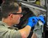 Senior Airman Daniel Phillis, an aerospace propulsion helper from the 910th Aircraft Maintenance Squadron here, cleans an engine mounting point on a C-130H Hercules aircraft here, March 7, 2018.