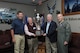 U.S. Air Force Lt. Gen. Steve Kwast, commander of Air Education and Training Command, (at right) and Dr. Joe Leverett, Altus Trophy committee chairman announced Biloxi, Mississippi, as the 2017 Altus Trophy winner and presented the award to John Boothby and Lenny Sawyer of the Biloxi Bay Area Chamber of Commerce at Joint Base San Antonio-Randolph, Texas, March 8, 2018. The Altus Trophy is given to the community judged to have shown outstanding support to an AETC base. (U.S. Air Force photo by Joel Martinez)