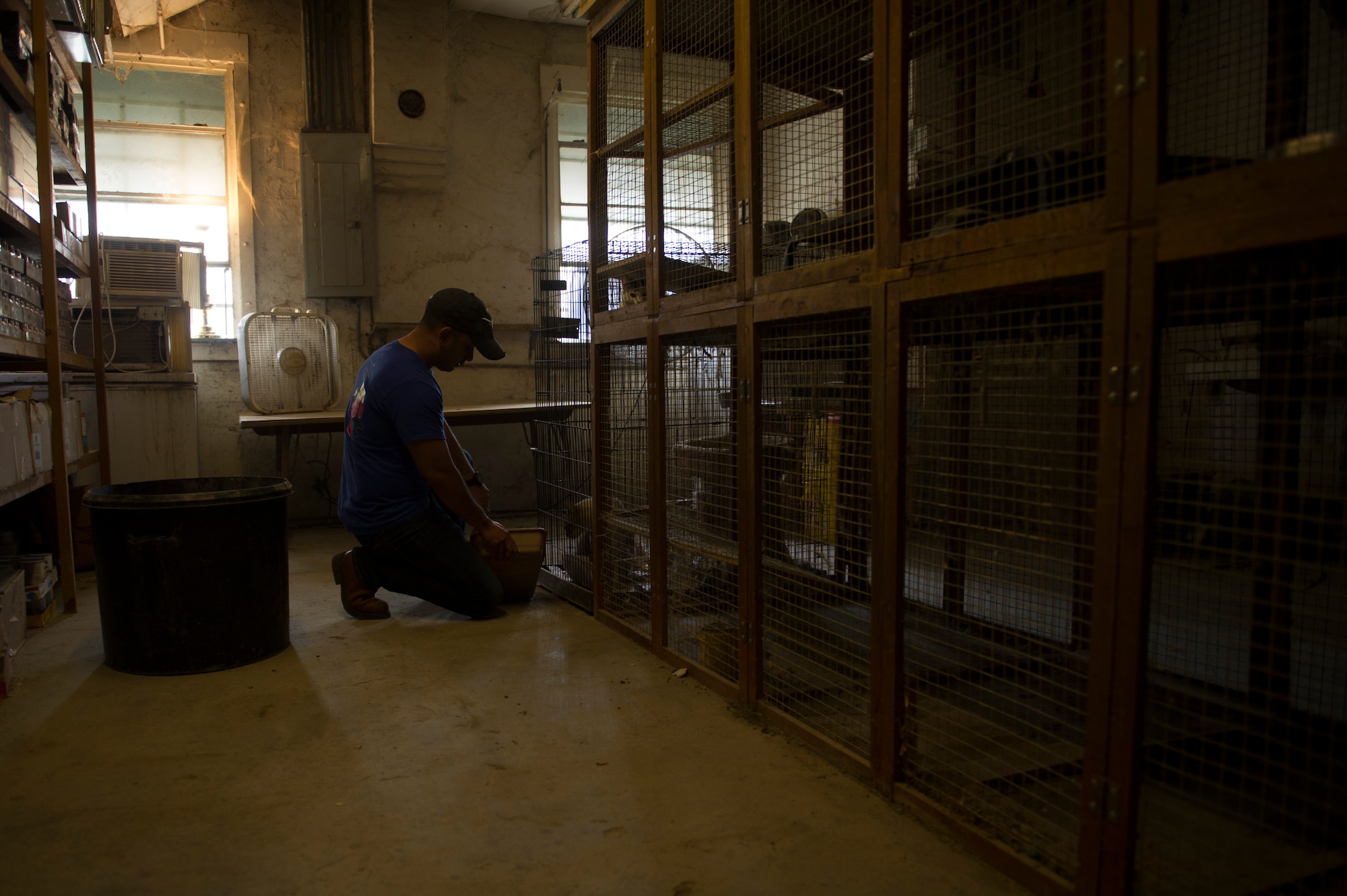 Tech. Sgt. Arturo Garcia, 47th Student Squadron command support staff NCO in charge, cleans a cat litter box at an animal shelter in Del Rio, Texas, March 3, 2018. With nearly 500 volunteers that day, the 47th Student Squadron dedicated approximately 15,000 man hours to serving the local community. (U.S. Air Force photo/ Airman 1st Class Benjamin N. Valmoja)