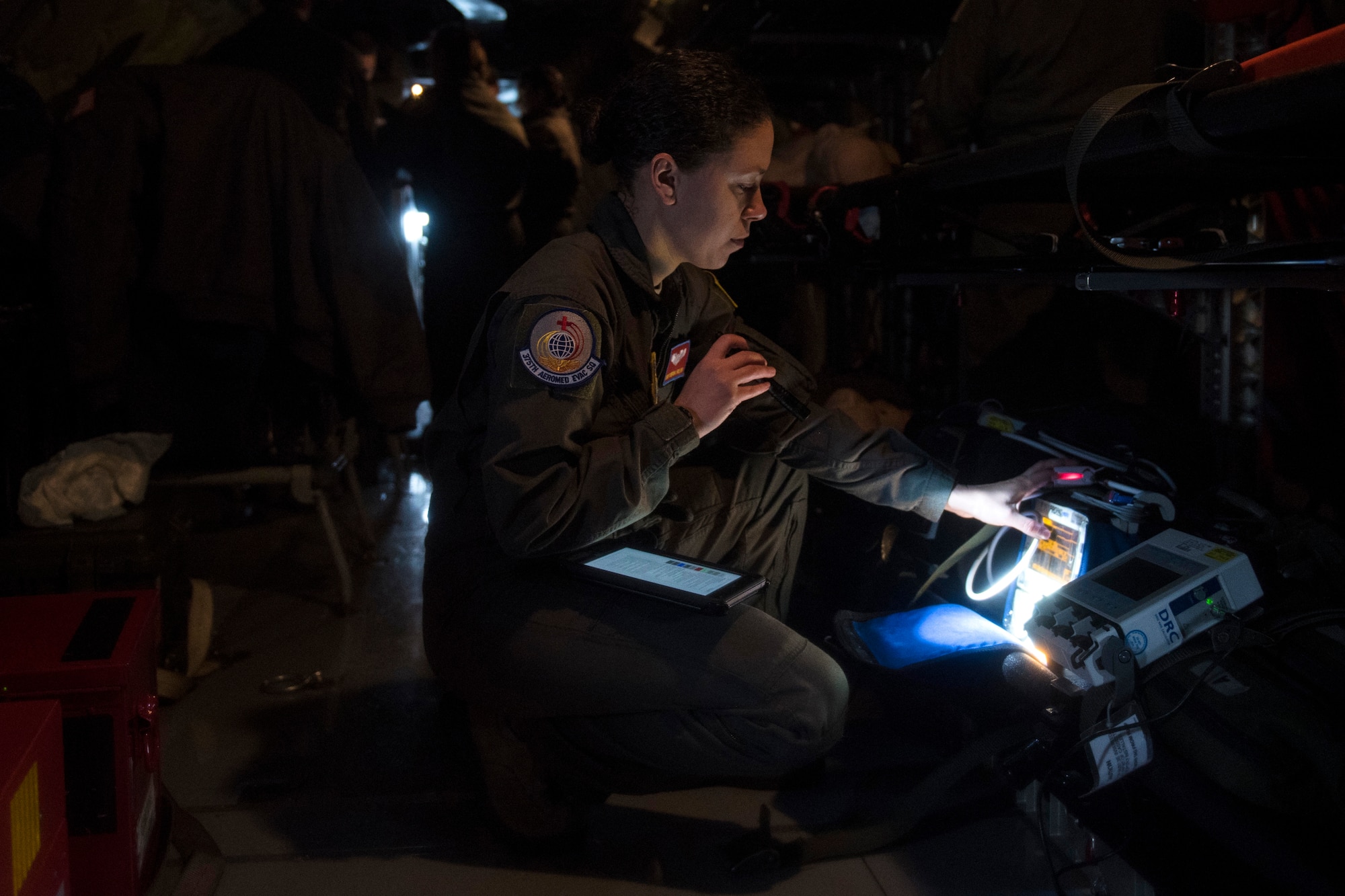 Staff Sgt. Kendra Fulton, 375th Aeromedical Evacuation Squadron technician, inspects the pulse oximeter as well as other medical equipment to confirm proper functionality during an aeromedical evacuation training at Fairchild Air Force Base, Washington, March 1, 2018. It is a top priority to ensure all medical gear can help AE Airmen provide care while patients are transported. (U.S. Air Force photo/Airman 1st Class Whitney Laine)