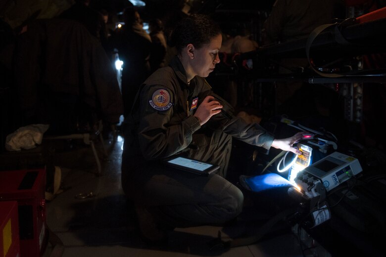 Staff Sgt. Kendra Fulton, 375th Aeromedical Evacuation Squadron technician, inspects the pulse oximeter as well as other medical equipment to confirm proper functionality during an aeromedical evacuation training at Fairchild Air Force Base, Washington, March 1, 2018. It is a top priority to ensure all medical gear can help AE Airmen provide care while patients are transported. (U.S. Air Force photo/Airman 1st Class Whitney Laine)