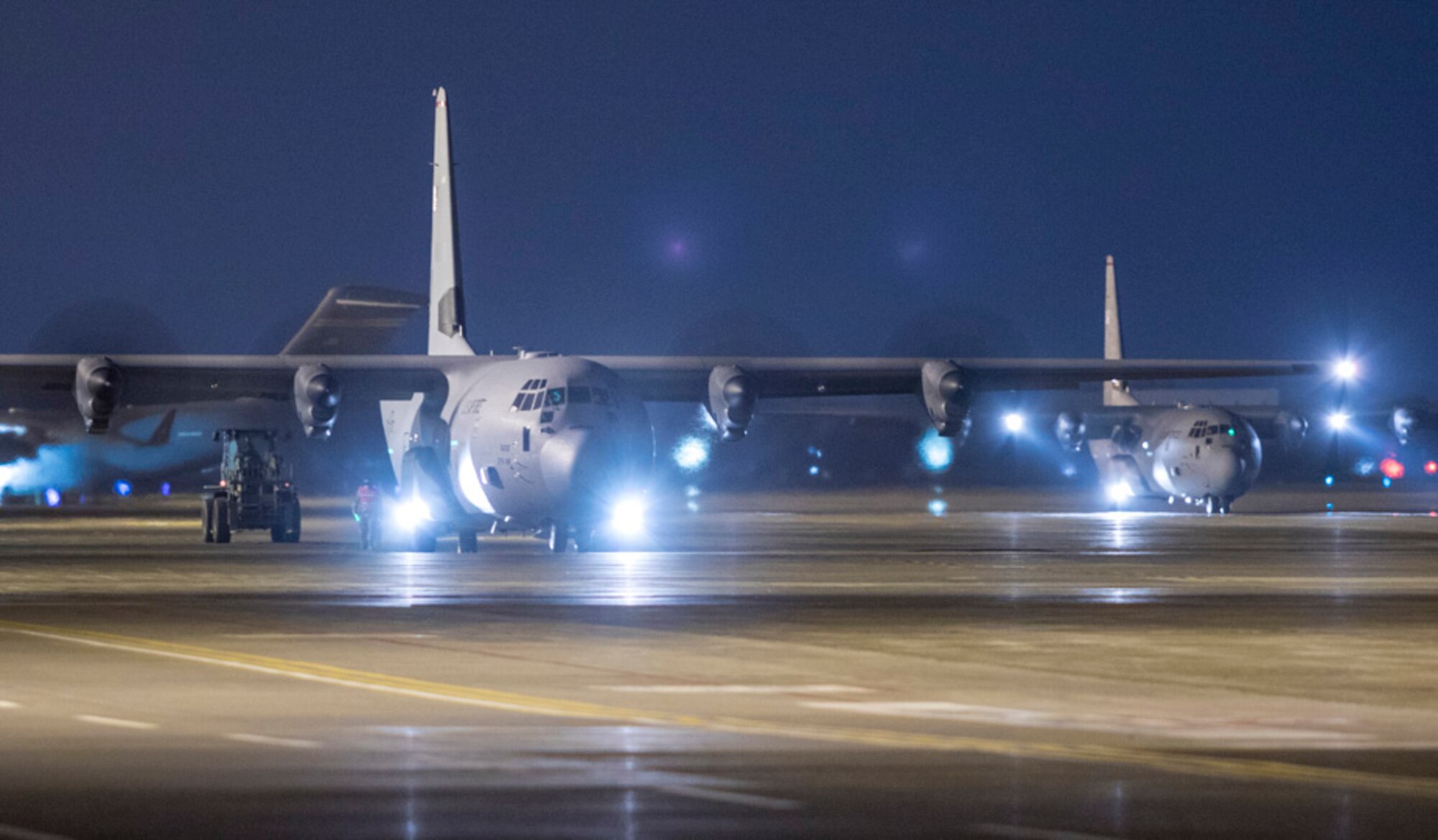 Airmen with the 374th Logistics Readiness Squadron combat mobility flight perform offloading a cargo from a C-130J Super Hercules while engine running operation (ERO)