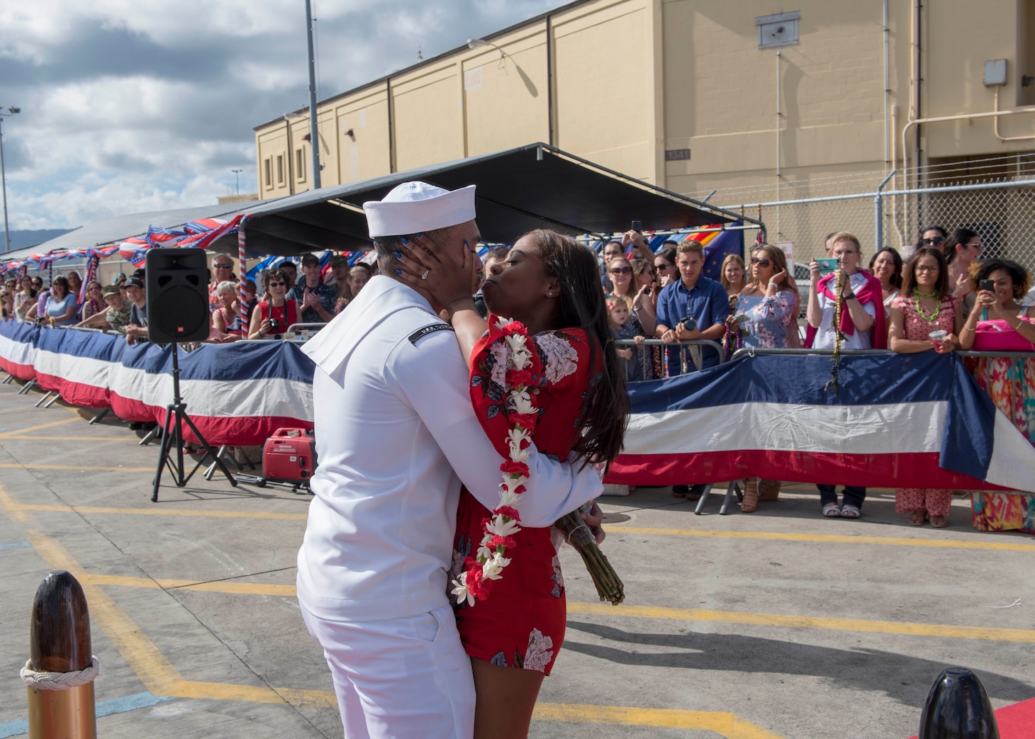 PEARL HARBOR (Mar. 7, 2018) A Sailor stationed aboard the Los Angeles-class fast attack submarine USS Tucson(SSN 770), is greeted by his loved one on the pier at Joint Base Pearl Harbor-Hickam after returning from a six-month Western Pacific deployment, Mar. 7. (U.S. Navy Photo by Mass Communication Specialist 2nd Class Shaun Griffin/Released)