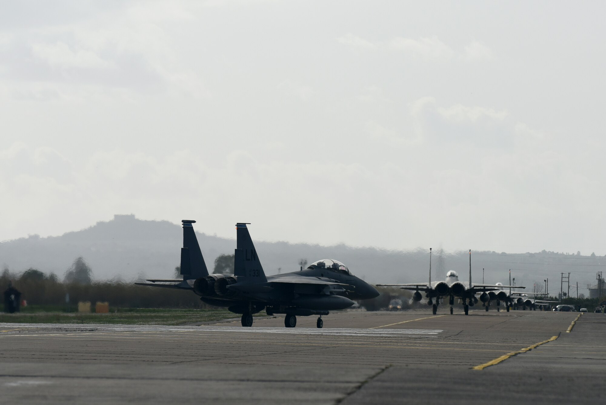 F-15E Strike Eagles, assigned to the 492nd Fighter Squadron from Royal Air Force Lakenheath, England, taxi on the runway of Andravida Air Base, Greece, March 7. The F-15s are scheduled to participate in INIOHOS 18, a Hellenic Air Force-led flying exercise that utilizes a single base concept, meaning all seven nations will fly operations out of the same location. (U.S. Air Force photo/Airman 1st Class Eli Chevalier)