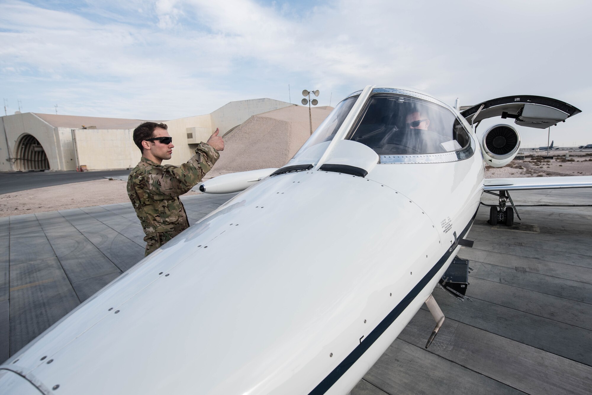 U.S. Air Force 1st Lt. Riley Snowden, a pilot assigned to the 746th Expeditionary Airlift Squadron, performs pre-flight tasks in the flight deck of a C-21 at Al Udeid Air Base, Qatar, Feb. 7, 2018. The C-21 is primarily used to deliver members of leadership most commonly consisting of general officer or their civilian counterparts, quickly and efficiently to bases across the U.S. Central Command’s area of responsibility. (U.S. Air National Guard photo by Master Sgt. Phil Speck)