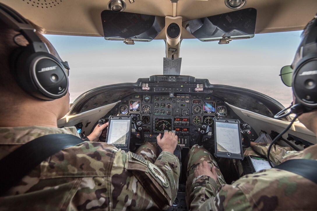 U.S. Air Force 1st Lt. Riley Snowden, a pilot assigned to the 746th Expeditionary Airlift Squadron, performs pre-flight tasks in the flight deck of a C-21 at Al Udeid Air Base, Qatar, Feb. 7, 2018. The C-21 is primarily used to deliver members of leadership most commonly consisting of general officer or their civilian counterparts, quickly and efficiently to bases across the U.S. Central Command’s area of responsibility. (U.S. Air National Guard photo by Master Sgt. Phil Speck)
