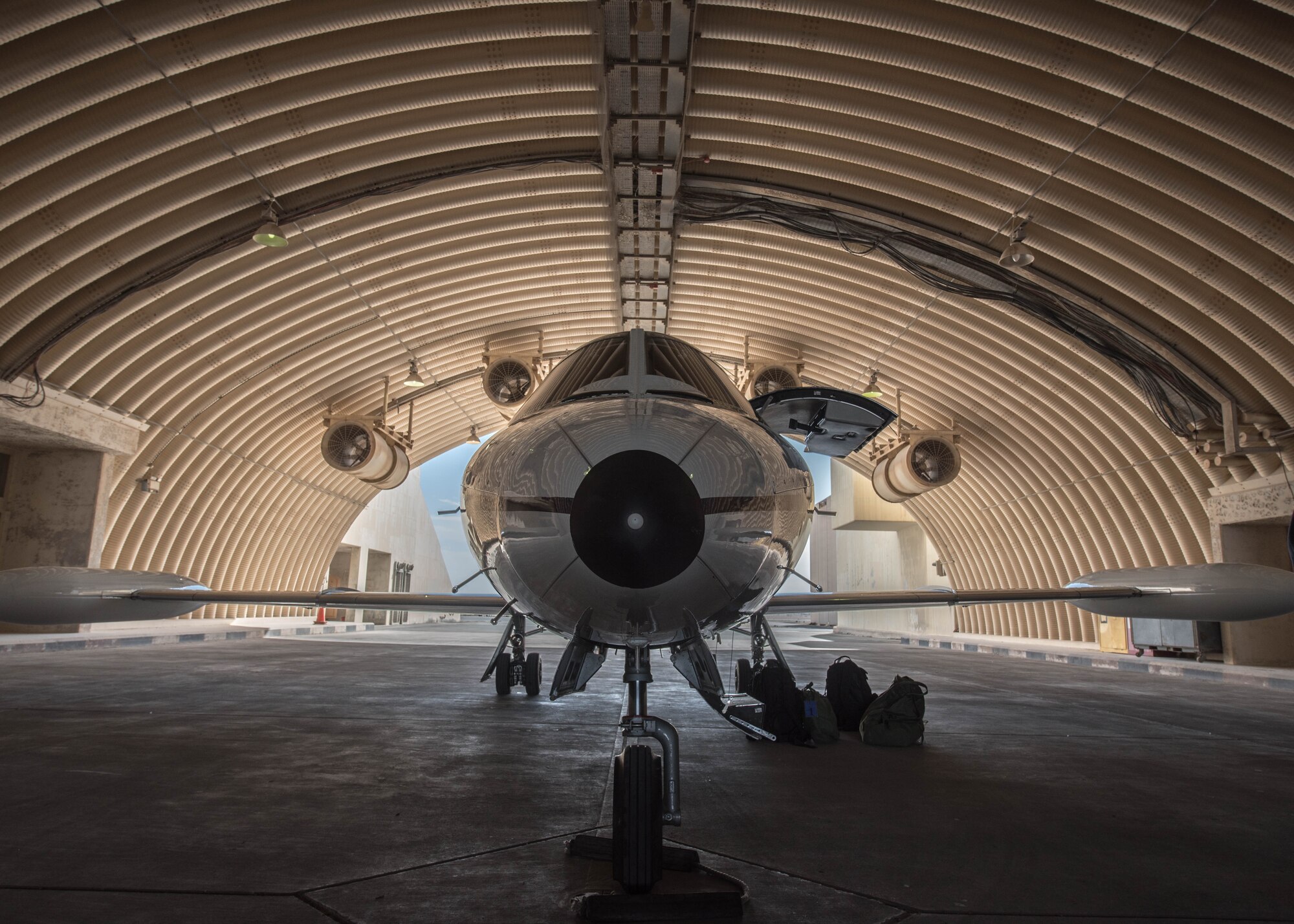 U.S. Air Force 1st Lt. Riley Snowden, a pilot assigned to the 746th Expeditionary Airlift Squadron, performs pre-flight tasks in the flight deck of a C-21 at Al Udeid Air Base, Qatar, Feb. 7, 2018. The C-21 is primarily used to deliver members of leadership most commonly consisting of general officer or their civilian counterparts, quickly and efficiently to bases across the U.S. Central Command’s area of responsibility. (U.S. Air National Guard photo by Master Sgt. Phil Speck)