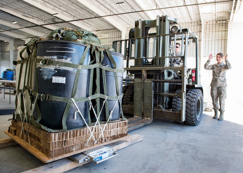 Small Air Terminal personnel from the 133rd Logistics Readiness Squadron weigh a Containerized Delivery System (CDS) load for an airdrop mission in Yuma, Ariz., Feb. 26, 2018.