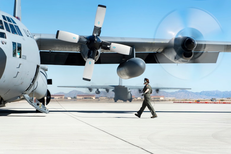 U.S. Air Force Senior Airman Jenna Nyberg, a load master with the 109th Airlift Squadron, performs an engine check on a C-130 Hercules in Yuma, Ariz., Feb. 26, 2018.