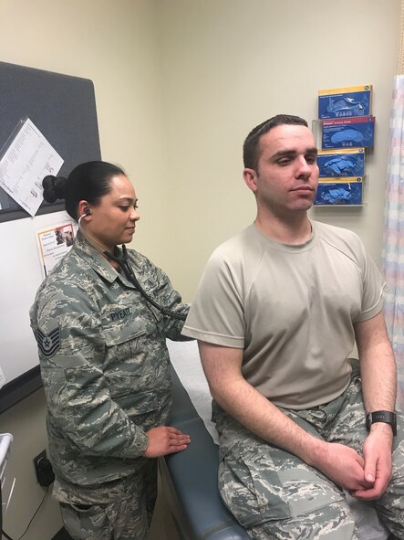 Tech. Sgt. Christina Pyeatt, an Independent Duty Medial Technician at Joint Base Elmendorf-Richardson, Alaska checks in on a patient, Feb. 2018. Having been in the Air Force for a year and a half, Pyeatt explains how women can bring unique perspectives and approaches to help tackle challenging issues. (Courtesy photo)