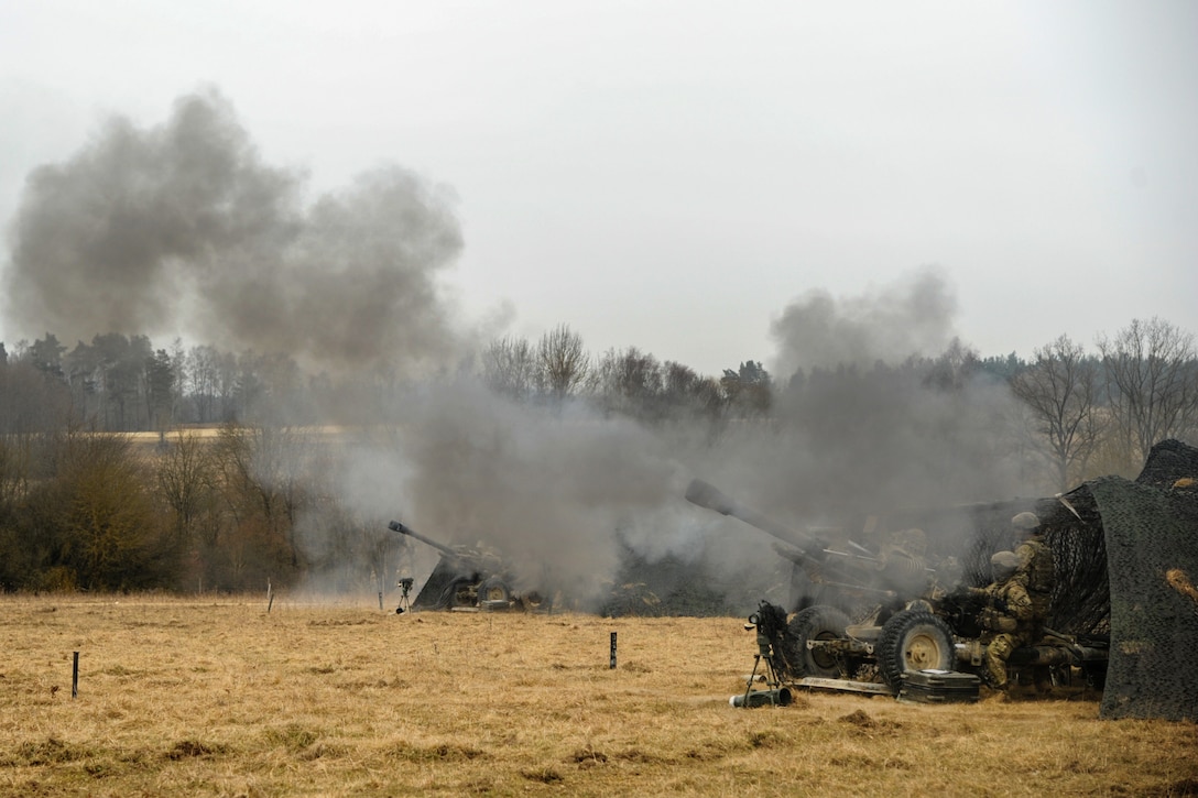 Soldiers conduct howitzer live-fire.