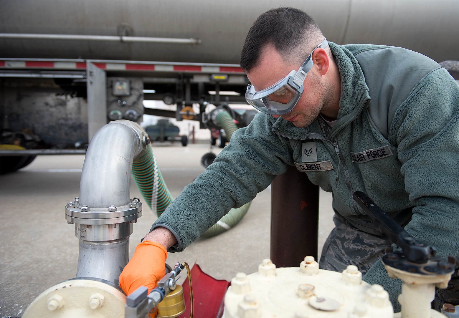 Fuels lab technician pull fuel samples and testing them.