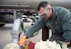 Fuels lab technician pull fuel samples and testing them.