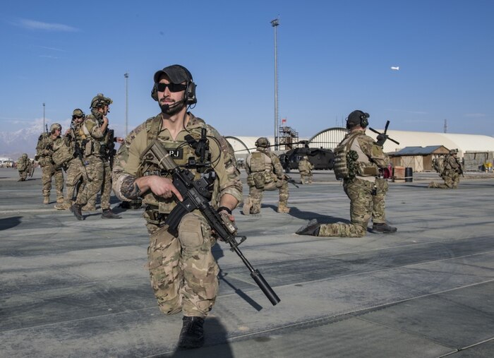 Air Force pararescuemen, assigned to the 83rd Expeditionary Rescue Squadron, set up a perimeter.