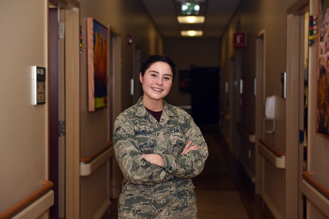 Airman 1st Class Kayla Jaramillo, an aerospace medical technician at the Buckley Air Force Base Colfax Clinic, in Aurora, Colorado administers a vaccine to a patient Feb 9, 2018. Out of hundreds of paintings submitted for the 2017 Air Force Art Contest, Jaramillo placed first in the Adult Novice Category with a painting she titled “Swallow your Pride, Life isn’t Fair”. (U.S. Air Force photo by Senior Airman Jessica B. Kind)