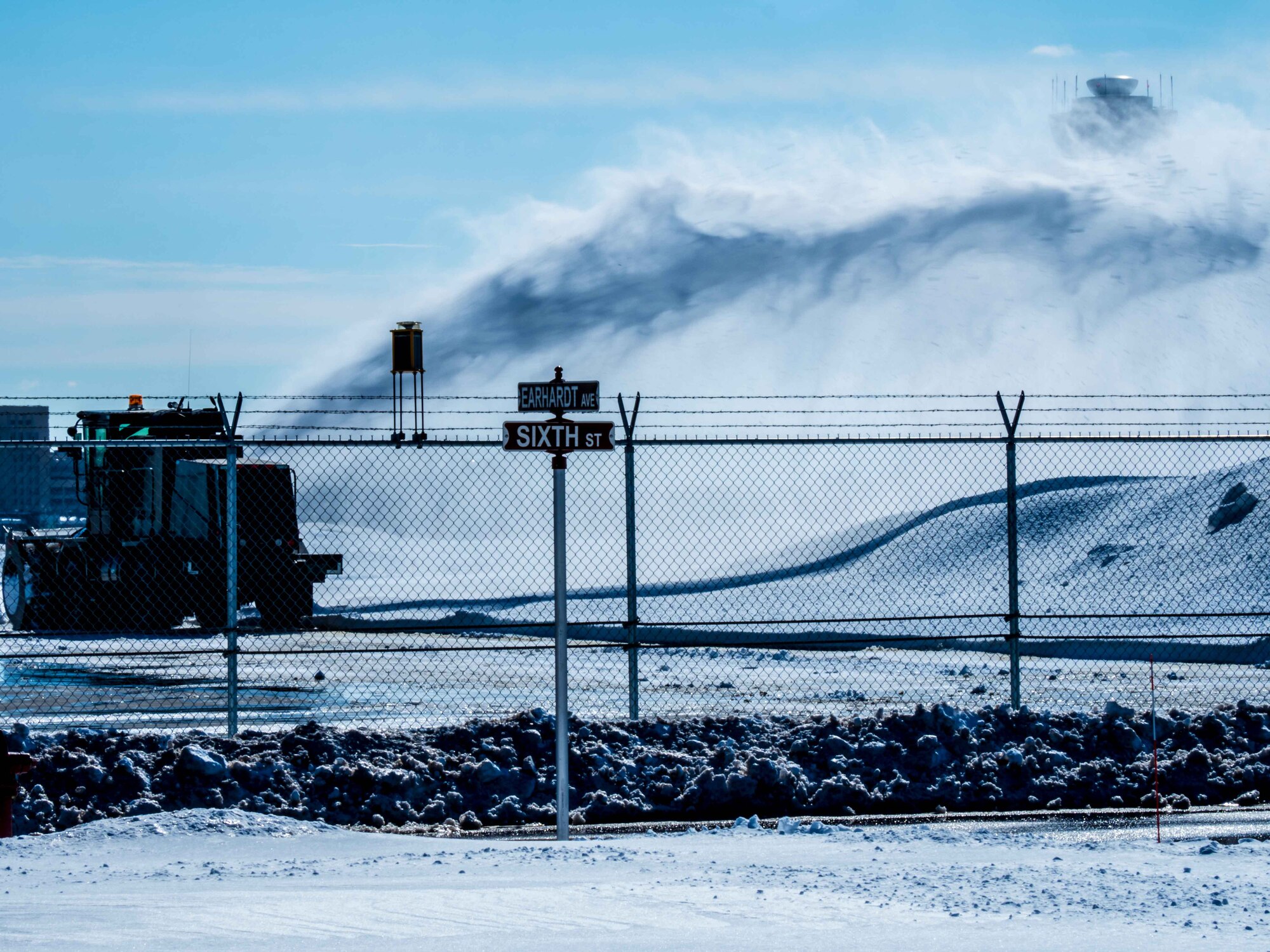 Spring may be right around the corner but there's still plenty of snow to be cleared at the 934th Airlift Wing March 7. (Air Force Photo/Paul Zadach)