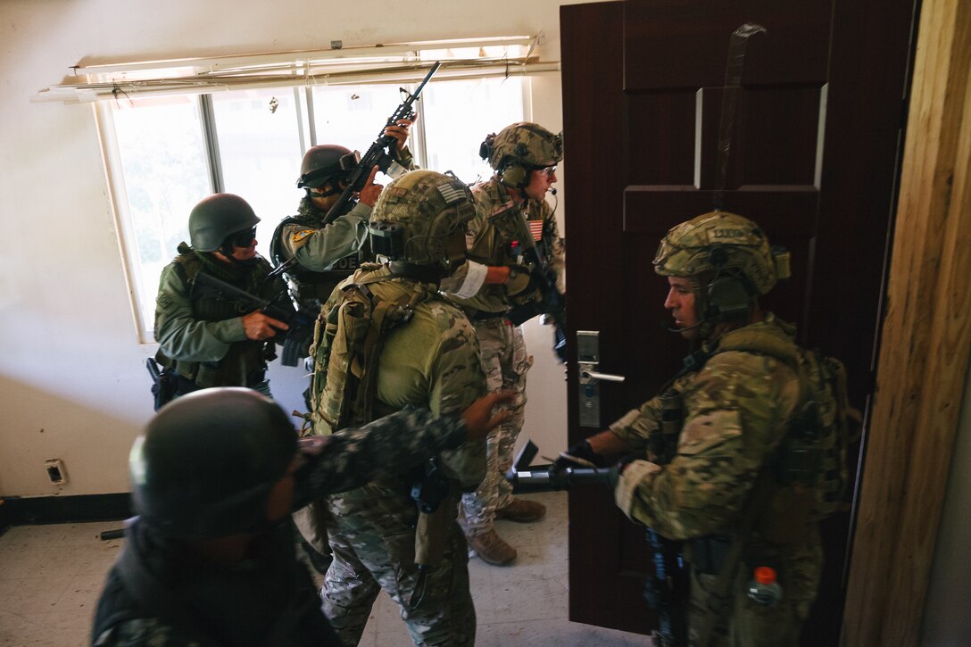 Military personnel train.