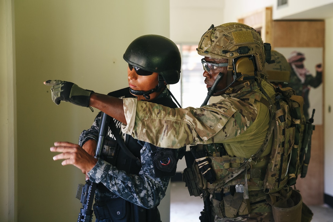 Military personnel train.