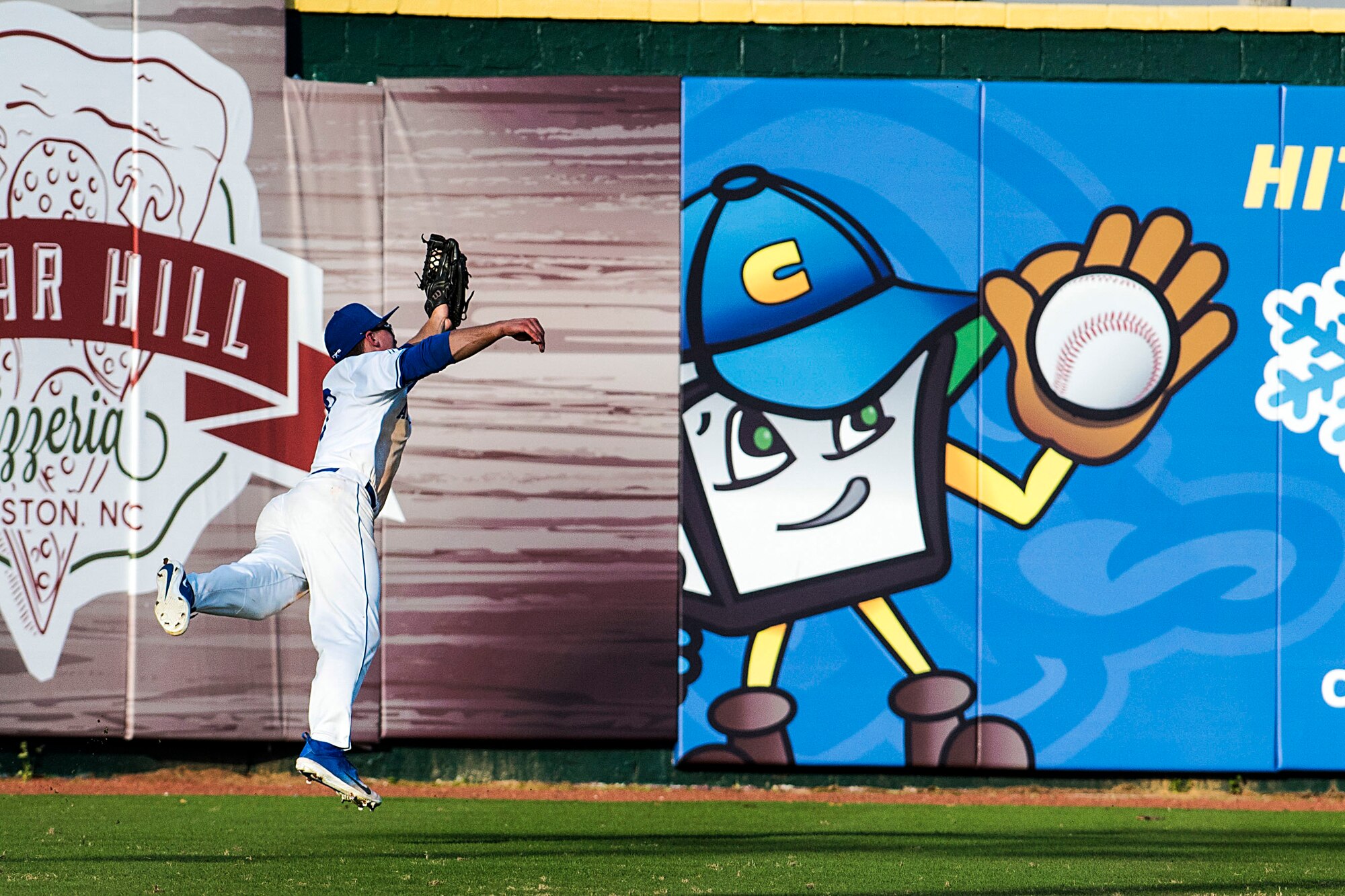 Air Force Academy center fielder Daniel Jones runs down a well-hit ball to right, during the Freedom Classic baseball tournament at Grainger Stadium in Kinston, N.C., Feb. 24, 2018. Jones is a third-year cadet at the Air Force Academy originally from Coppell, Texas. (U.S. Air Force photo by Tech. Sgt. David W. Carbajal)