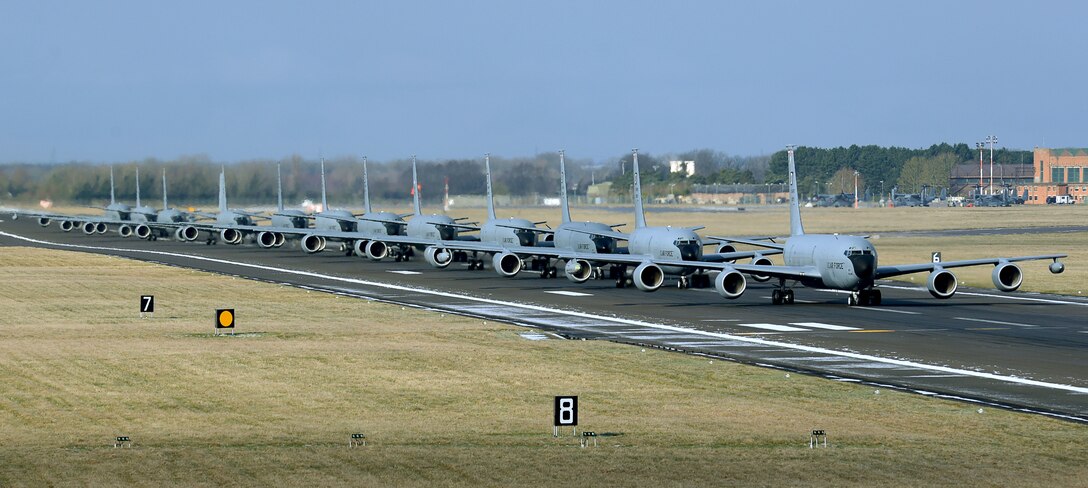Twelve U.S. Air Force KC-135 Stratotankers, assigned to the 100th Air Refueling Wing, taxi down the runway at RAF Mildenhall, England, Feb. 27, 2018. The show of force maneuver demonstrated the readiness of the wing to provide global air refueling support at short notice. (U.S. Air Force photo by Senior Airman Justine Rho)