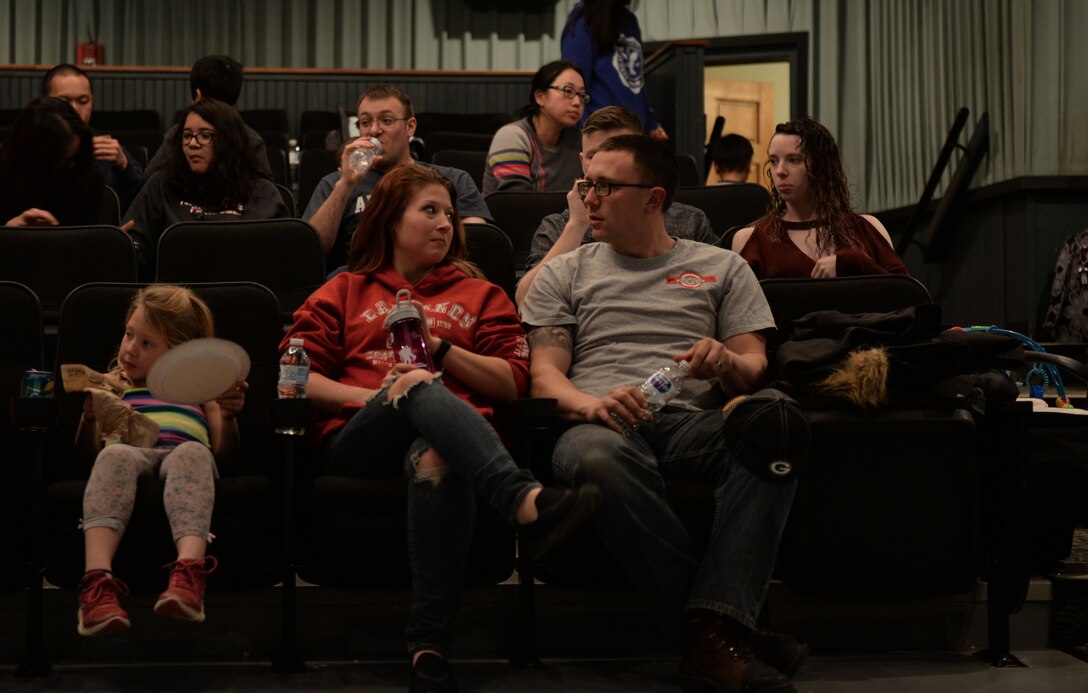Staff Sgt. Michael Ryan, an armament crew systems member assigned to the 28th Munitions Squadron, and his spouse, Heather, bond during a Hearts Apart event at the Elks Theater in Rapid City, S.D., March 3, 2018. The event welcomed families reintegrating after a deployment, as well as families dealing with a current or upcoming deployment. (U.S. Air Force photo by Airman 1st Class Nicolas Z. Erwin)