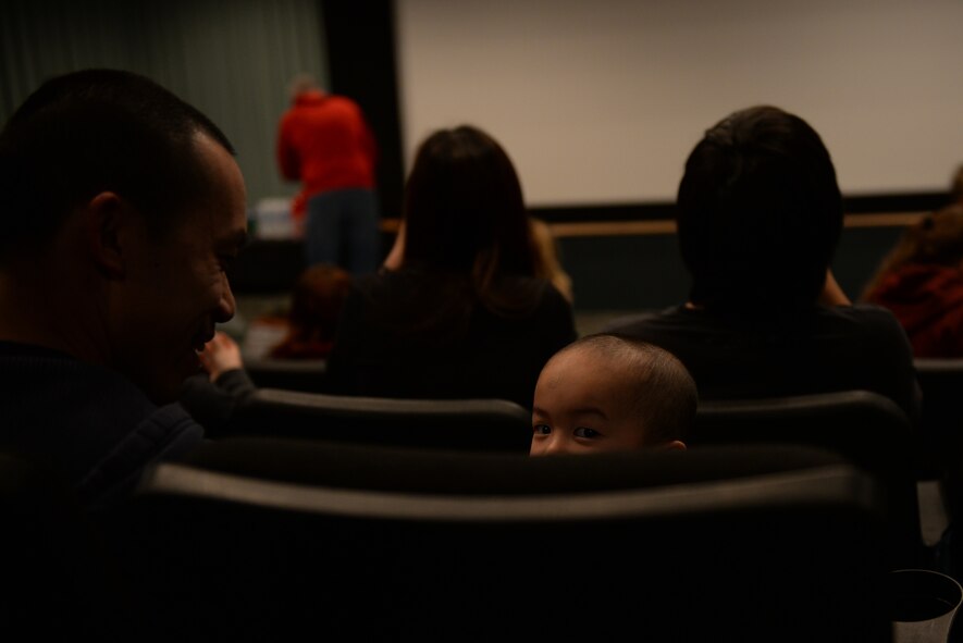 Tech. Sgt. Huy Nguyen, a senior weapons system controller assigned to the 28th Maintenance Group, and his family attend a movie and dinner during a Hearts Apart event at the Elks Theater in Rapid City, S.D., March 3, 2018. The Airman and Family Readiness Center at Ellsworth Air Force Base, S.D., hosted the event to help bring together families facing deployed or soon-to-be deployed parents and spouses.  (U.S. Air Force photo by Airman 1st Class Nicolas Z. Erwin)