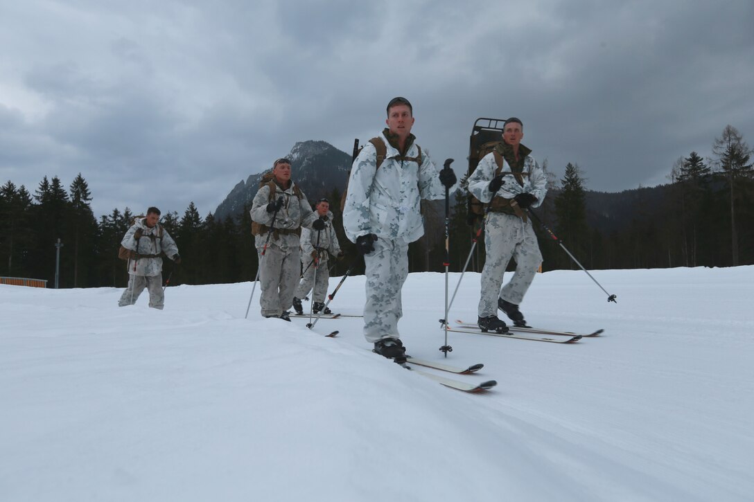 Marines from the Mountain Leaders Section, Mountain Warfare Training Center, Bridgeport, Calif., move through the first touring ski event at the International Mountain Warfare Patrol Competition 18 at Cheimgau Arena, Rupholding, Germany, March 7, 2018. "Team America" is one of twelve teams participating in the competition that tests mountain infantry skills and tactics. (U.S. Marine Corps photo by Lance Cpl. Preston L. Morris)