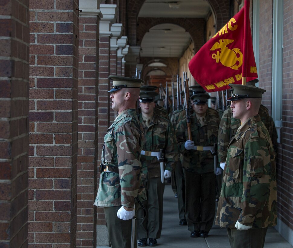 Gunnery Sgt. Aaron Calderon, drill master, Marine Barracks Washington, critiques the marching elements of MBW to hone and sharpen their drill sequences as they conduct Phase I and Phase II drill practice on the parade deck at Marine Barracks Washington D.C., Mar. 9, 2018. The Marines execute these iterations three days a week in preparation for the upcoming 2018 Parade Season. (Official Marine Corps photo by Pfc. James Bourgeois/Released)