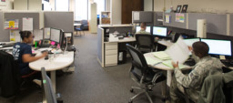 U.S. Air Force Staff Sgt. Isaiah Resto, 20th Comptroller Squadron (CPTS) financial analysis supervisor, right, Senior Airman Jordan Keller, 20th CPTS Budget technician, center, and Christine Jones, 20th CPTS budget analyst, manage the 20th Fighter Wing budget at Shaw Air Force Base, S.C., March 2, 2018.