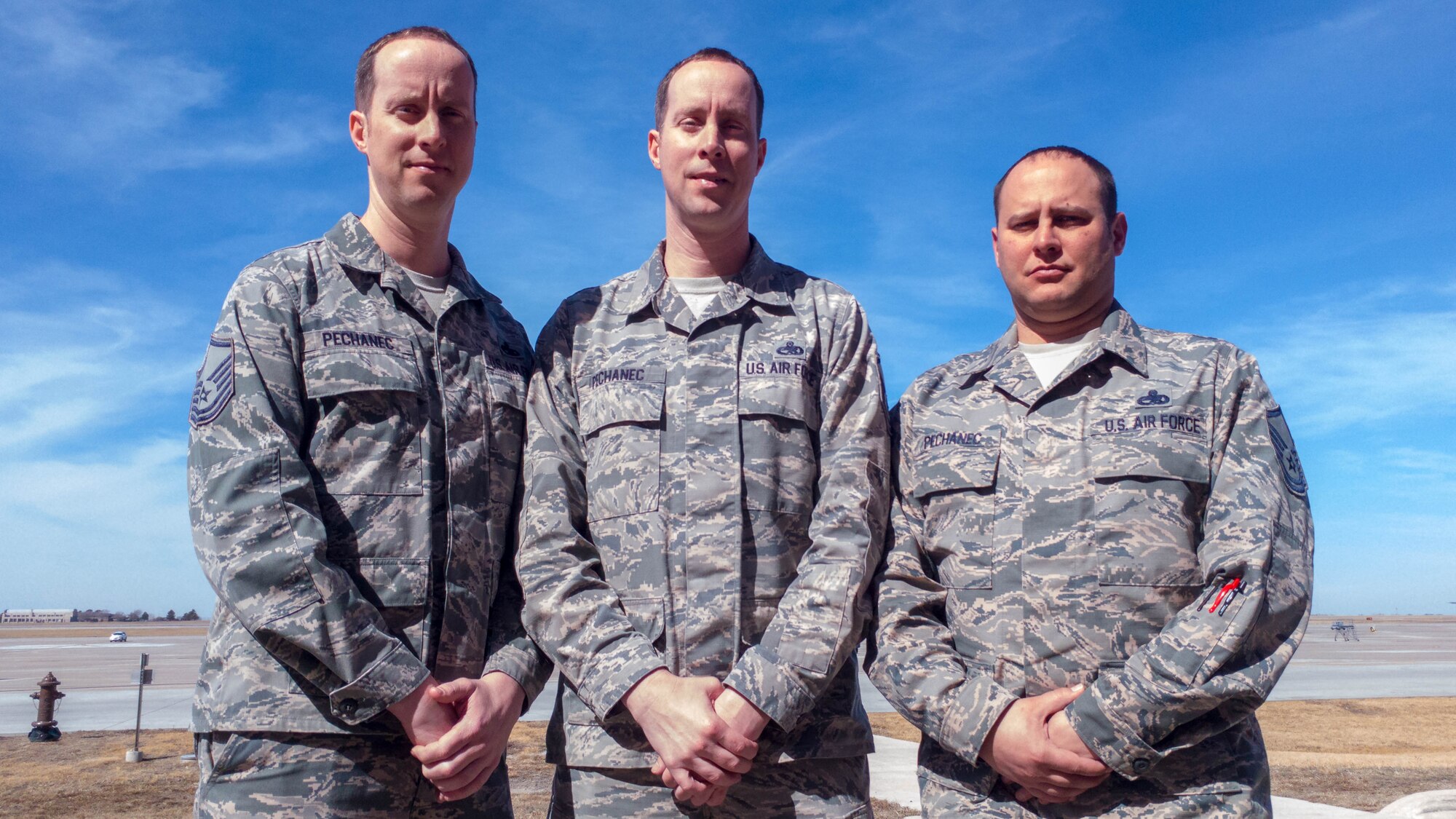 From left, Master Sgt. Brent Pechanec, 931 AMXS flight expediter, Master Sgt. Bryan Pechanec, 931 AMXS aircraft overall supervisor, and Master Sgt. Andrew Pechanec, 22 MXS Inspection Section crew chief, all serve at McConnell Air Force Base, Kan.