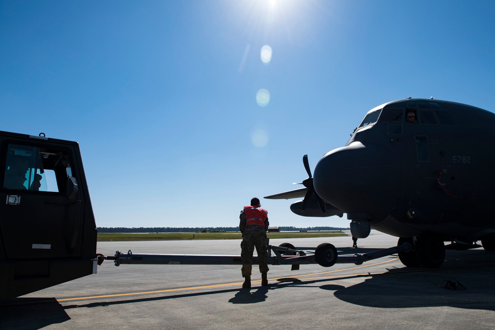 Airmen from the 71st Aircraft Maintenance Unit tow an HC-130J Combat King II during an aircraft pull challenge, March 9, 2018, at Moody Air Force Base, Ga. The challenge was part of a Comprehensive Airman Fitness super sports day event where the 71st AMU and 41st Helicopter Maintenance Unit faced off for bragging rights. (U.S. Air Force Photo by Senior Airman Janiqua P. Robinson)