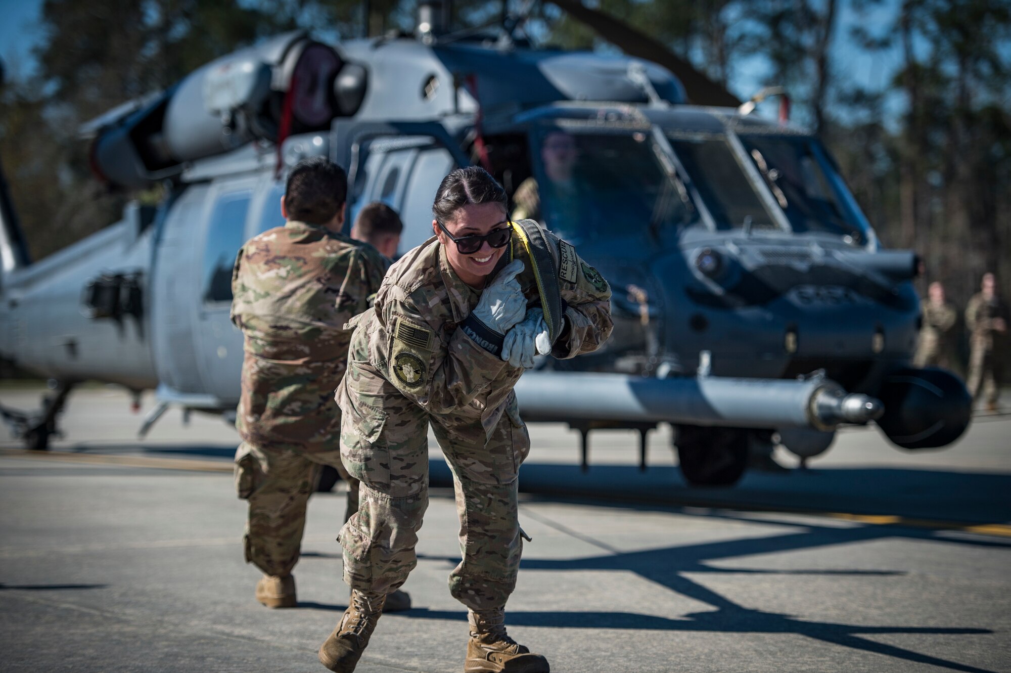 Airmen from the 71st Aircraft Maintenance Unit pull an HH-60G Pave Hawk helicopter during an aircraft pull challenge, March 9, 2018, at Moody Air Force Base, Ga. The challenge was part of a Comprehensive Airman Fitness super sports day event where the 71st AMU and 41st Helicopter Maintenance Unit faced off for bragging rights. (U.S. Air Force Photo by Senior Airman Janiqua P. Robinson)