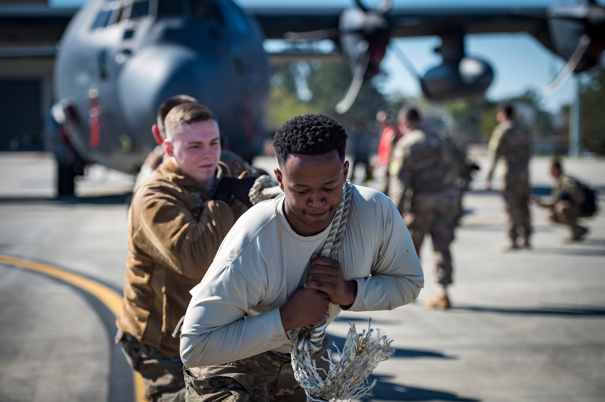 Airmen from the 71st Aircraft Maintenance Unit pulls an HC-130J Combat King II during an aircraft pull challenge, March 9, 2018, at Moody Air Force Base, Ga. The challenge was part of a Comprehensive Airman Fitness super sports day event where the 71st AMU and 41st Helicopter Maintenance Unit faced off for bragging rights. (U.S. Air Force Photo by Senior Airman Janiqua P. Robinson)