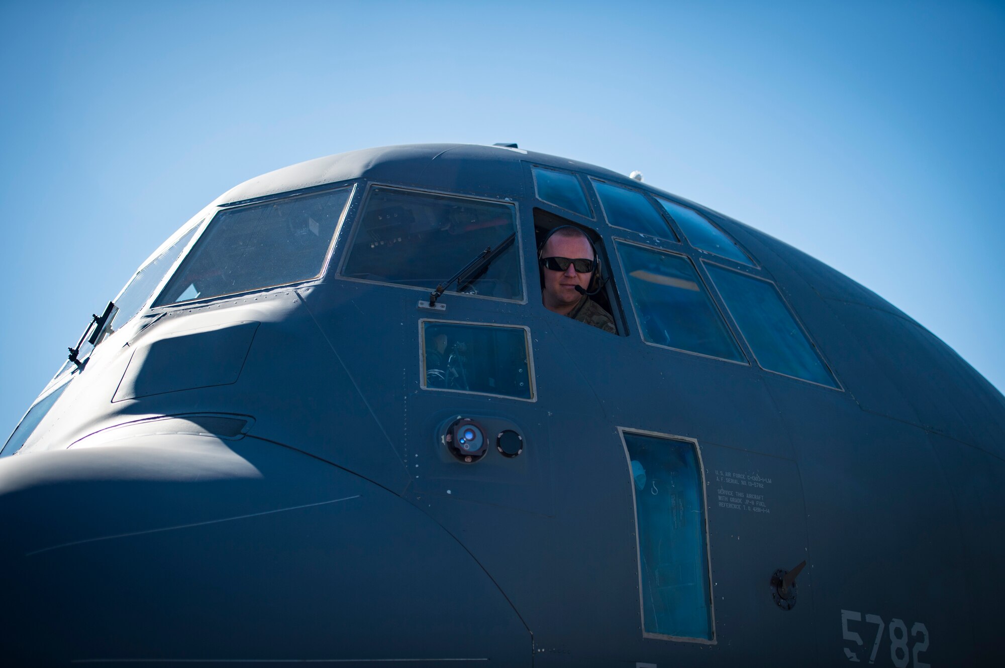 An Airman from the 71st Aircraft Maintenance Unit sits in an HC-130J Combat King II during an aircraft pull challenge, March 9, 2018, at Moody Air Force Base, Ga. The challenge was part of a Comprehensive Airman Fitness super sports day event where the 71st AMU and 41st Helicopter Maintenance Unit faced off for bragging rights. (U.S. Air Force Photo by Senior Airman Janiqua P. Robinson)