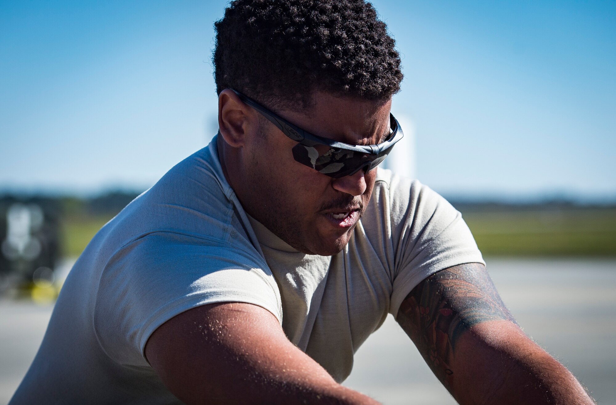 An Airman from the 41st Helicopter Maintenance Unit pulls an HC-130J Combat King II during an aircraft pull challenge, March 9, 2018, at Moody Air Force Base, Ga. The challenge was part of a Comprehensive Airman Fitness super sports day event where the 41st HMU and 71st Aircraft Maintenance Unit faced off for bragging rights. (U.S. Air Force Photo by Senior Airman Janiqua P. Robinson)