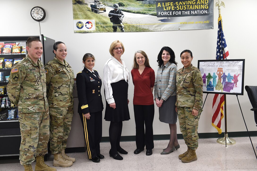 U.S. Army Reserve Soldiers assigned to the 85th Support Command pause for a photo with panel members during the command’s Women’s History Month observance at the headquarters, Mar. 4, 2018.