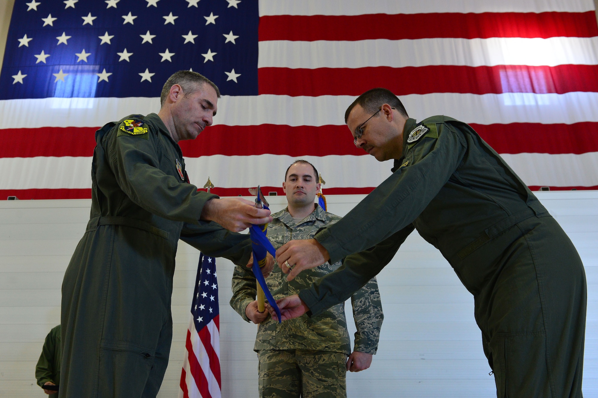 Col. Joseph, 432nd Operations Group commander and Lt. Col. Nicholas, 15th Attack Squadron commander case the 15th Expeditionary ATKS guidon March 9, 2018, at Creech Air Force Base, Nev. The final MQ-1 Predator combat line was flown in an undisclosed area of responsibility by Airmen of the 15th ATKS during the official MQ-1 retirement ceremony. (U.S. Air Force photo by Airman 1st Class Haley Stevens)