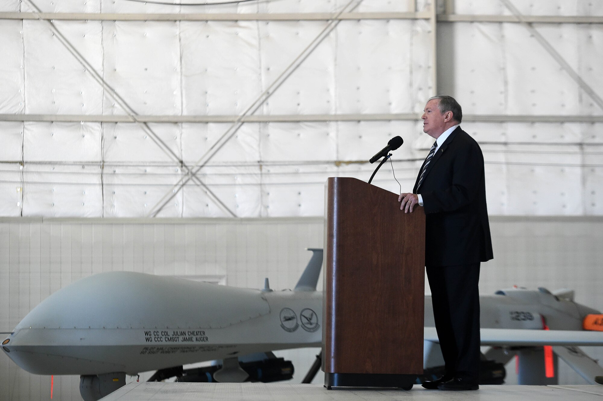 Mr. James G. “Snake” Clark, the director, Intelligence, Surveillance and Reconnaissance, Modernization and Infrastructure and Deputy Chief of Staff for ISR, Headquarters U.S. Air Force, speaks at the MQ-1 Predator retirement ceremony March 9, 2018, at Creech Air Force Base, Nev. Clark played a role in the Air Force acquisition of the MQ-1 Predator and has seen it through many developments, including arming it with munitions, evolving its mission set from ISR to persistent attack. (U.S. Air Force photo by Senior Airman James Thompson)