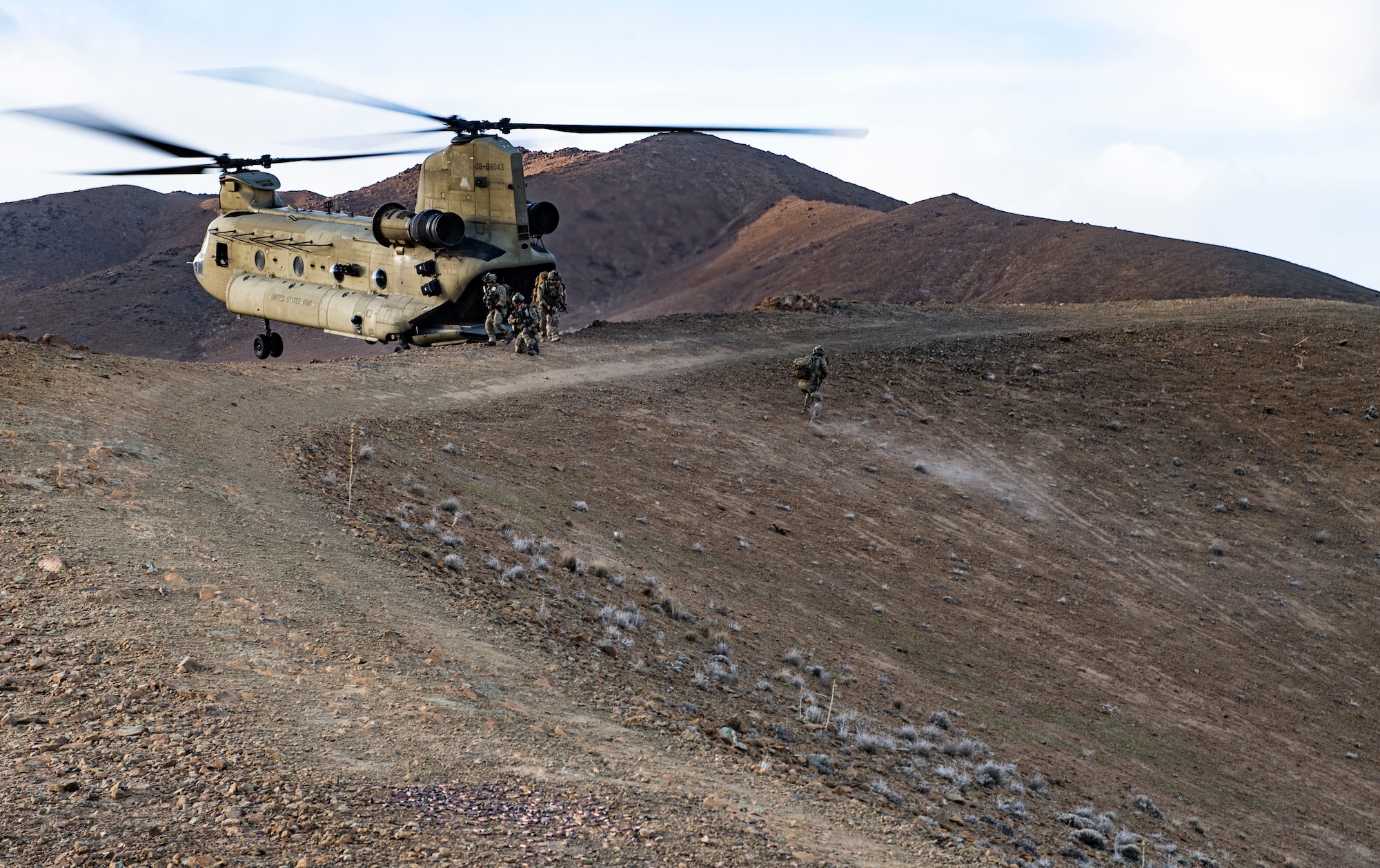 U.S. Air Force pararescuemen and combat rescue officers, assigned to the 83rd Expeditionary Rescue exit a U.S. Army CH-47F Chinook, flown by members of Task Force Brawler, to conduct casualty evacuation during a personnel recovery exercise at Bagram Airfield, Afghanistan, March 6, 2018.