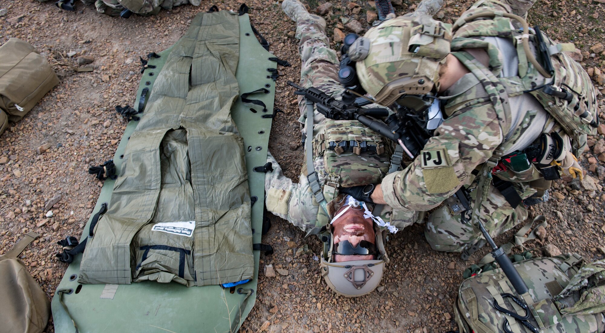 A U.S. Air Force pararescueman, assigned to the 83rd Expeditionary Rescue Squadron, performs tactical combat casualty care on a simulated casualty during a personnel recovery exercise at an undisclosed location in Afghanistan, March 6, 2018.