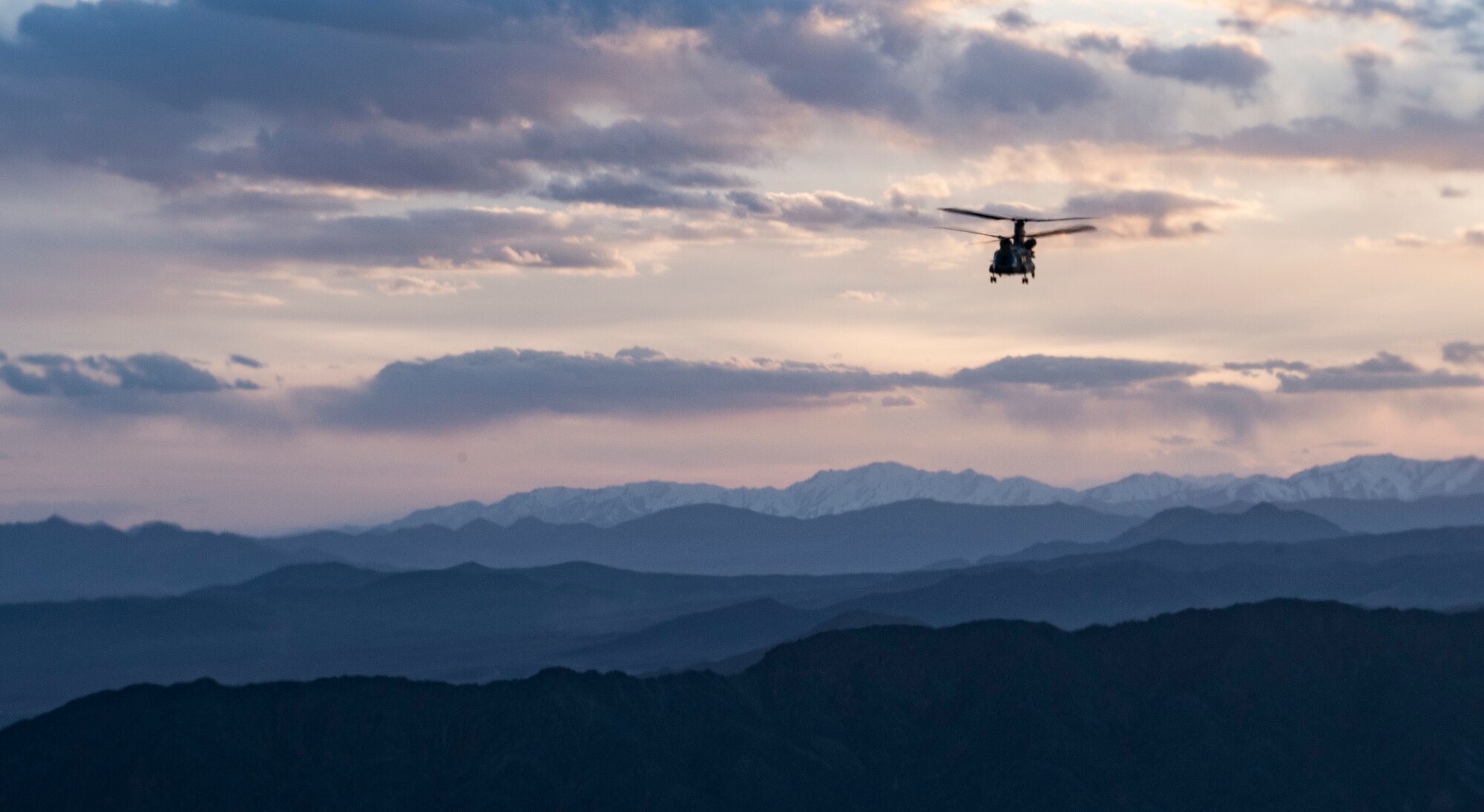 A U.S. Army Task Force Brawler CH-47F Chinook flies while conducting a personnel recovery exercise with a Guardian Angel team assigned to the 83rd Expeditionary Rescue Squadron at Bagram Airfield, Afghanistan, March 6, 2018.