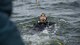 U.S. Navy Diver 2nd Class Mitchell Apgar, assigned to Commander, Fleet Activities Sasebo, dives into Lake Ogawara during cleanup efforts in Tohoku Town, Japan, March 10, 2018.