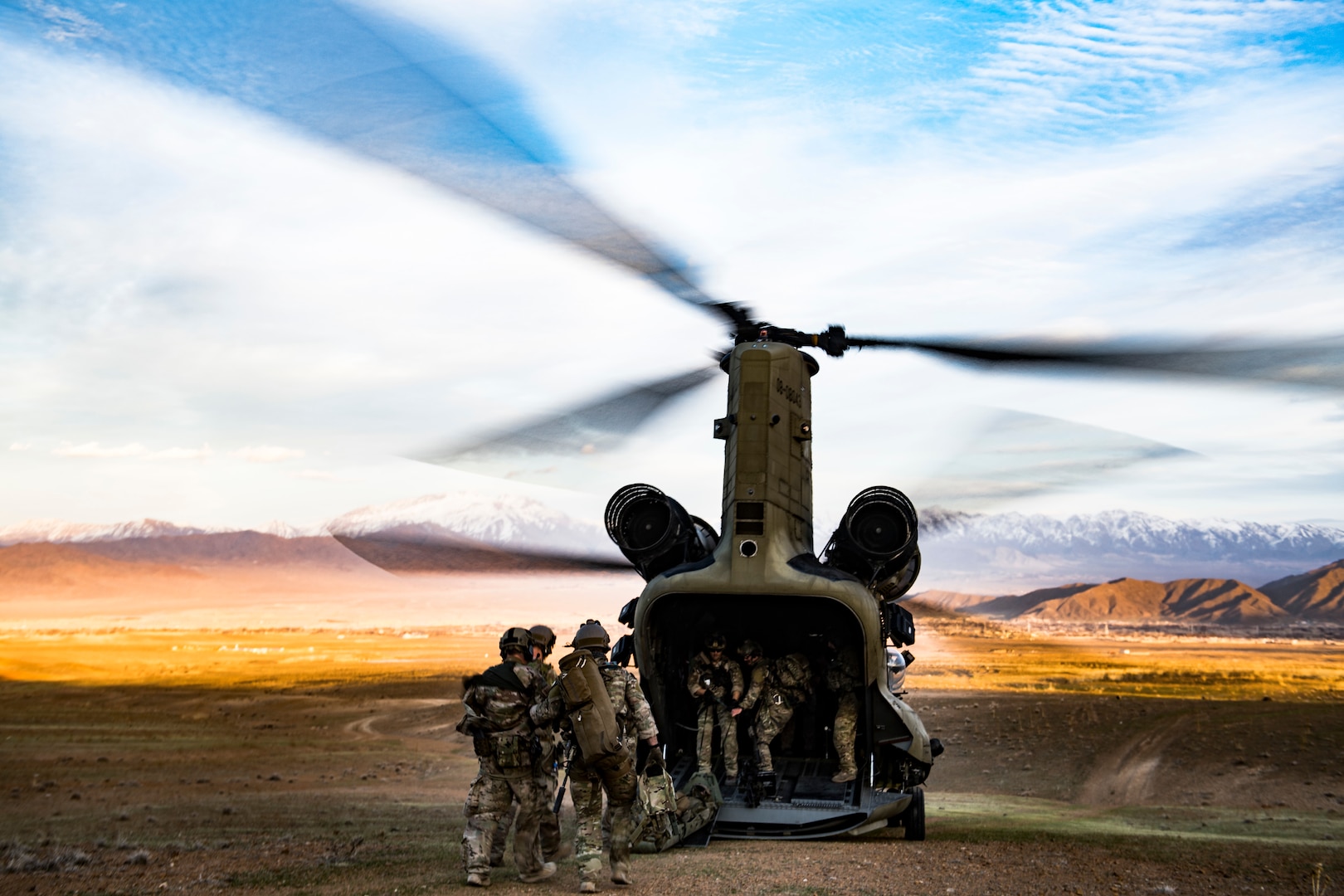 Air Force pararescuemen assigned to 83rd Expeditionary Rescue Squadron load simulated casualties on board CH-47F Chinook, flown by members of Army Task Force Brawler, during personnel recovery exercise, Afghanistan, March 6, 2018 (U.S. Air Force/Gregory Brook)